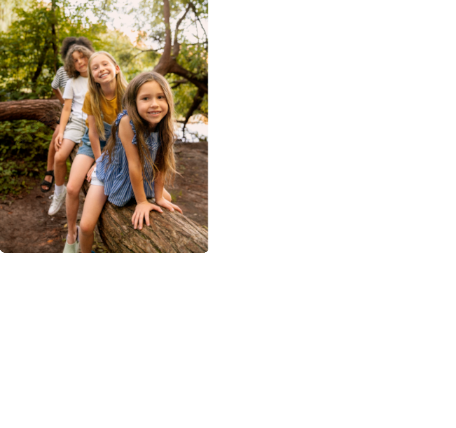 full-shot-smiley-kids-sitting-log
